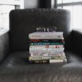 assorted books on black couch