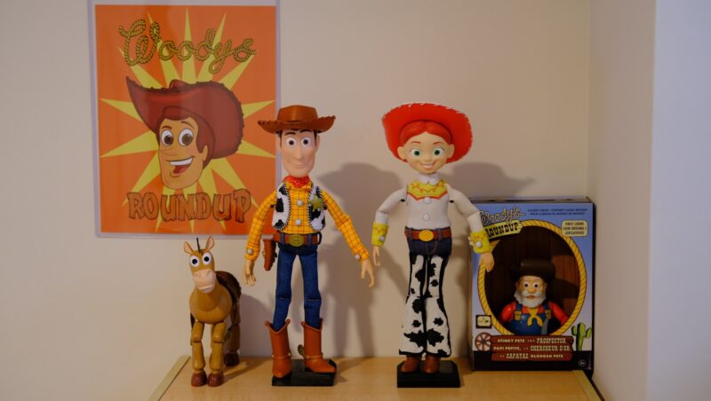 a couple of toy figurines sitting on top of a shelf