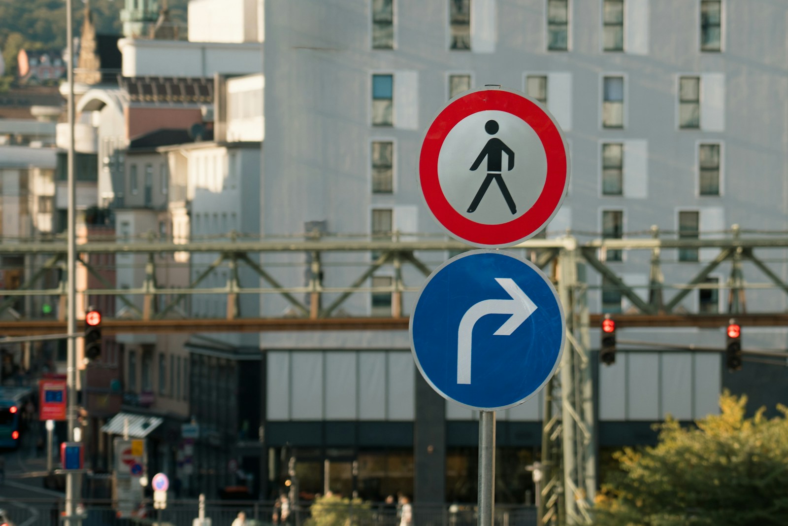 Pedestrian crossing sign above a turn right sign