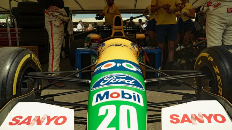 Front view of a race car with sponsors